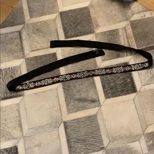 Brown fabric belt with jewels.